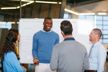 Aufkleber - Sharing his vision. Cropped shot of a group of businesspeople talking in the boardroom.