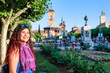 © Sangiao_Photography - Plaza de Cervantes in Alcala de Henares tourism heritage. Hispanic mid-female journey confident
