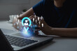 © MUNTHITA - Business people showing the target customer on laptop. Target customer, buyer persona, customer behavior concept. Marketing plan and strategies. Personalization marketing, customer-centric strategies.