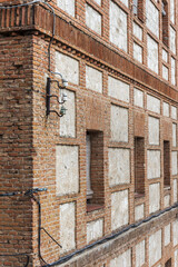 Wall Mural - An old building with old-looking adobe walls and porcelain