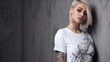 Oversize, white, Galliano, style t - shirt, mockup, photo with girl, topmodel, with tatoos, light concrete, background, professional mockup, photo 