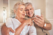 © Bettencourt/peopleimages.com - Home, smile and senior couple with a smartphone, love and quality time with social media, chatting and sms. Cellphone, old man and elderly woman with happiness, mobile app and relax with connection