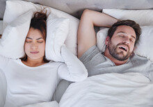 Snoring, Stress And Above Angry Woman With Sleeping Man In Bed, Unhappy And Frustrated, Insomnia And Crisis. Bedroom, Fail And Top View Of Lady With Noise, Issue And Annoyed By Snore Or Sleep Apnea