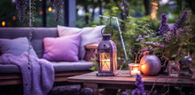 Cozy Outdoor Living. Living Corner In The Garden Outside The House. Summer Evening On The Patio Or Terrace Of Suburban House With Flowers, Candles And Lantern In The Garden, Digital Ai Art	