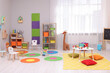 © New Africa - Child`s playroom with different toys and furniture. Cozy kindergarten interior