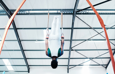 Canvas Print - Gymnastics, rings and man at gym for fitness, workout and body, performance or training. Balance, exercise and guy acrobat at sports studio for athletics, resilience and cardio, hanging or endurance