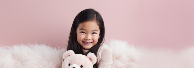 Wall Mural - Portrait of Asian girl playing with toy bear doll