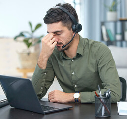 Wall Mural - Man, laptop and headache in call center, stress or debt in customer service or support at the office. Male person, consultant or agent with headphones and bad head pain in burnout at the workplace