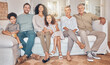 © Bettencourt/peopleimages.com - Happy big family, portrait and relax on sofa together for holiday weekend or bonding at home. Interracial parents, grandparents and kids smile in happiness for quality time on couch in living room