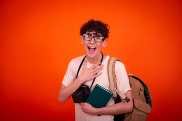 Wall Mural - A young attractive guy with a good mood went on a trip.