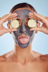 Wall Mural - Face mask, skincare and woman with beauty, cucumber and girl on a blue studio background. Portrait, female person and model with cosmetics, natural and aesthetic with hygiene, charcoal and self care