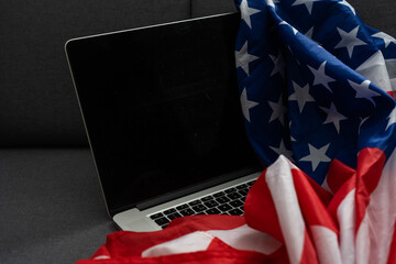 Internet and network security. Computer with binary computer code and American flag