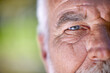 © ChasingMagic/peopleimages.com - Eyes, vision and old man, face closeup and wisdom with focus, insight and thinking with mockup space. Elderly male person outdoor, perspective or point of view with eyesight, wrinkles and thoughtful
