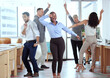 © ChasingMagic/peopleimages.com - Office, celebration and excited business people dance for success, achievement and team building. Corporate, collaboration and happy men and women dancing in workplace to celebrate bonus or profit