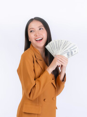 Successful beautiful Asian business young woman holding money US dollar bills in hand isolated on white background with copy space , business concept