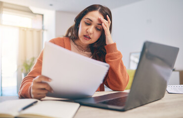 Documents, stress and woman on laptop in home with paperwork for online banking, finance and taxes. Remote work, worry and female person with computer for debt payment, financial report and bills