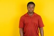© Roquillo - Young latin man wearing red t-shirt over yellow background depressed and worry for distress, crying angry and afraid. Sad expression.