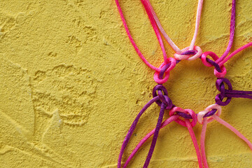 Braided multi-colored cords, painted tied together. The concept of creative cooperation and teamwork.