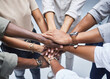 Hands, support and people together for teamwork, solidarity or group collaboration from above. Workforce, diversity and networking in community, business or company staff huddle for team building