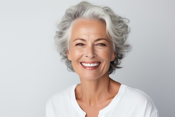 beautiful gorgeous 50s mid age beautiful elderly senior model woman with grey hair laughing and smil