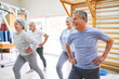 © Robert Kneschke - Happy senior males and females exercising at rehabilitation center