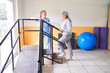 © Robert Kneschke - Physiotherapist assisting elderly woman in movement therapy