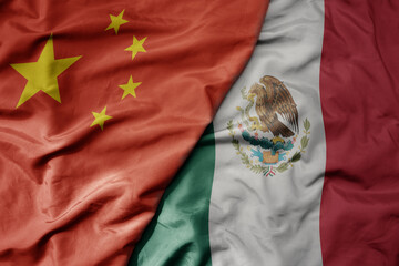 Canvas Print - big waving national colorful flag of china and national flag of mexico .