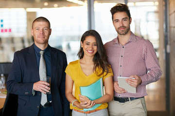 Wall Mural - Teamwork is how well achieve success. Cropped portrait of three businesspeople standing in the office.