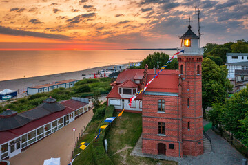 Wall Mural - Lighthouse in Ustka by the Baltic Sea at sunrise, Poland.