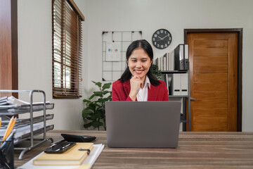 Sticker - Young beautiful businesswoman working on laptop in bright modern office