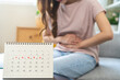 Menstruation, period cycle day of monthly, hurt asian young woman, female hand in stomach ache, suffer from PMS premenstrual, belly or abdomen pain on bed at home. Health problem Inflammation in body.