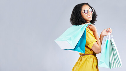 Poster - Woman, shopping and excited with bags at retail sale, promotion or happy for discount on studio, mockup or background. Customer, portrait and shop for fashion or sales on luxury clothing