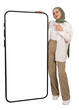 © Designerant - Pointing phone mock up, full body view young caucasian muslim girl in hijab pointing phone mock up. Huge big empty blank screen smartphone template. Transparent png background. Advertising, banner.