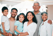 © Daniels C/peopleimages.com - Happy, excited and portrait of big family together in the backyard of their modern house. Happiness, smile and children bonding and posing with their grandparents and parents in garden by their home.