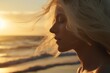 Young blonde european Caucasian girl dreaming pensive woman thoughtful lady calm peaceful female on seashore sunset golden hour beach seaside holiday summer vacation ocean waves relaxed contemplate