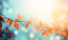 Abstract Autumn Nature Background, With Leaves On A Branch, Glowing Sun And Warm Seasonal Colors