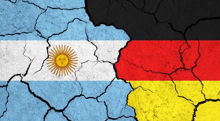 Flags of Argentina and Germany on cracked surface - politics, relationship concept