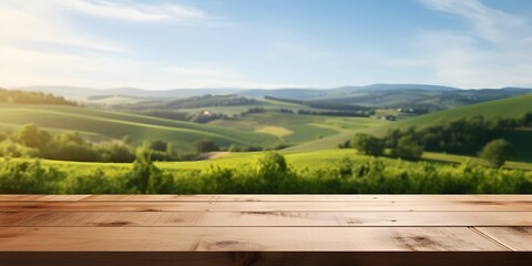 Empty wood table top with on blurred green vineyard landscape background in spring