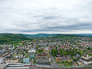Wall Mural - Aerial view of Swiss City of Winterthur with buildings, streets and scenic landscape on a cloudy spring morning. Photo taken May 17th, 2023, Winterthur, Switzerland.