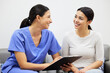 © Ismail/peopleimages.com - Clipboard, nurse and woman advice in clinic office, healthcare service and talking, question or consultation. Consulting, checklist and doctor, women or happy people, medical help or insurance survey