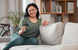© Daniels C/peopleimages.com - Credit card, phone and woman for home online shopping, e commerce or fintech payment on sofa. Relax, loan and happy young person with internet banking, e learning subscription or easy web transaction