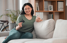 Credit Card, Phone And Woman For Home Online Shopping, E Commerce Or Fintech Payment On Sofa. Relax, Loan And Happy Young Person With Internet Banking, E Learning Subscription Or Easy Web Transaction