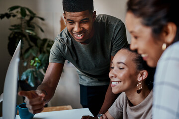 Poster - Taking on company growth with teamwork. Shot of a group of young businesspeople using a computer together in a modern office.