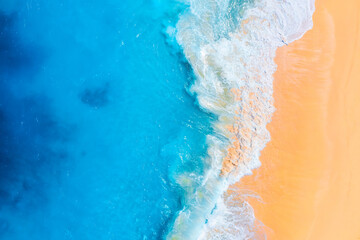 Wall Mural - coast as a background from top view. waves and beach. aerial landscape. azure water background from 
