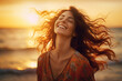 © Jasmina - Calm, free and happy woman enjoying a beautiful moment in life on the beach at sunset