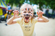 © Ekaterina Pokrovsky - Little preschooler girl with tiger face painting outdoors