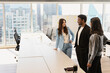 © Maria Vitkovska - Group of smiling multiracial business people working in modern office, talking, cooperation, sharing ideas, planning startup using agile methodology, scrum. Meeting Teamwork Successful business