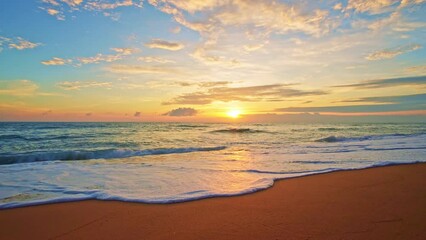 Wall Mural - Dramatic sea sunrise or sunset sky over sea. Burning sky and shining golden waves landscape,Beautiful waves crashing on sandy shore