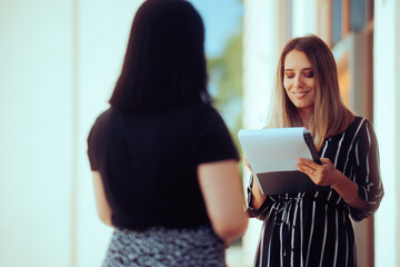 Woman Responding to a Survey Questionary on the Street. Interviewer interested to find out the public option in a sociological poll
