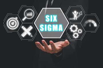 Six sigma concept, Business person hand holding six sigma icon on virtual screen.